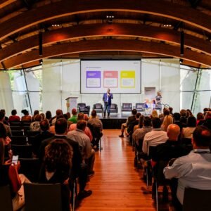 a man giving a presentation to a group of people